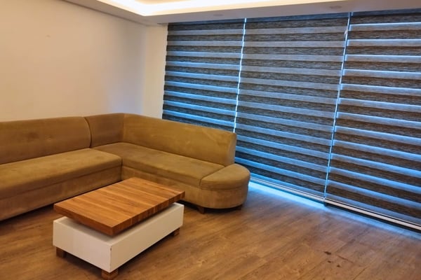 Inviting seating area with plush textures and warm tones, ideal for relaxing afternoons and quiet evening conversations.