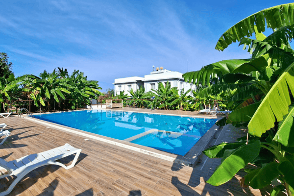 Discover a serene garden-level escape with private outdoor space and direct pool access—fully furnished and ready for immediate enjoyment.