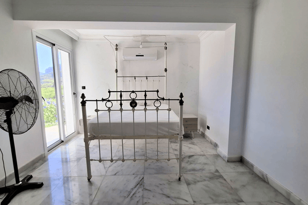 Room with bunk bed frame, likely a children’s room or guest room.