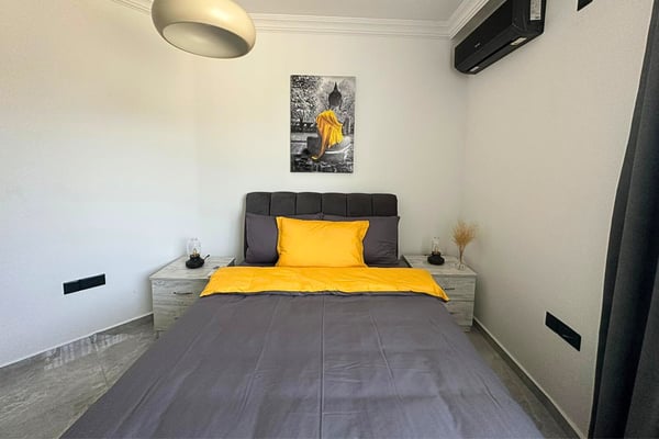Built-in wardrobe space in the bedroom, offering ample storage with a clean, seamless design.