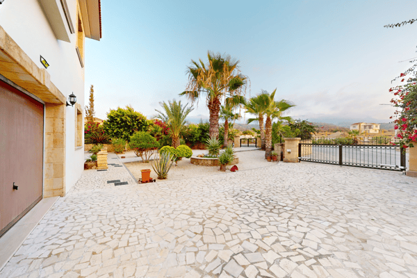 Spacious courtyard with dual garage entries and carefully placed landscaping.