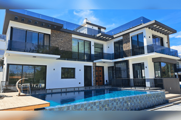 Experience the mediterranean charm with this striking villa offering rooftop serenity, panoramic scenery, and timeless architecture, designed for seamless living.