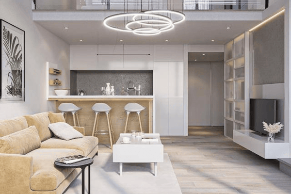 Contemporary kitchen and dining setup with bar stools, sleek finishes, and integrated appliances in an airy plan.