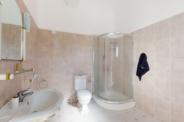 Clean and modern, this elegantly designed bathroom features high-end finishes and a serene ambiance for ultimate relaxation.