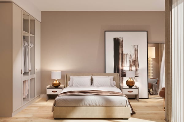 Cozy bedroom nook with soft lighting and artistic accents that offer a peaceful space for rest and reflection.
