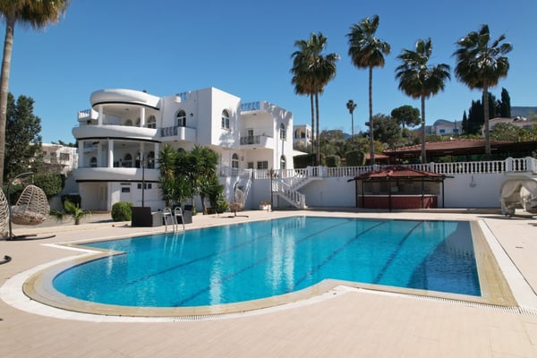 Discover an elegant boutique hotel featuring a Roman-end pool, landscaped gardens, and exquisite interiors. Perfect for a private retreat or an exclusive hospitality venture.