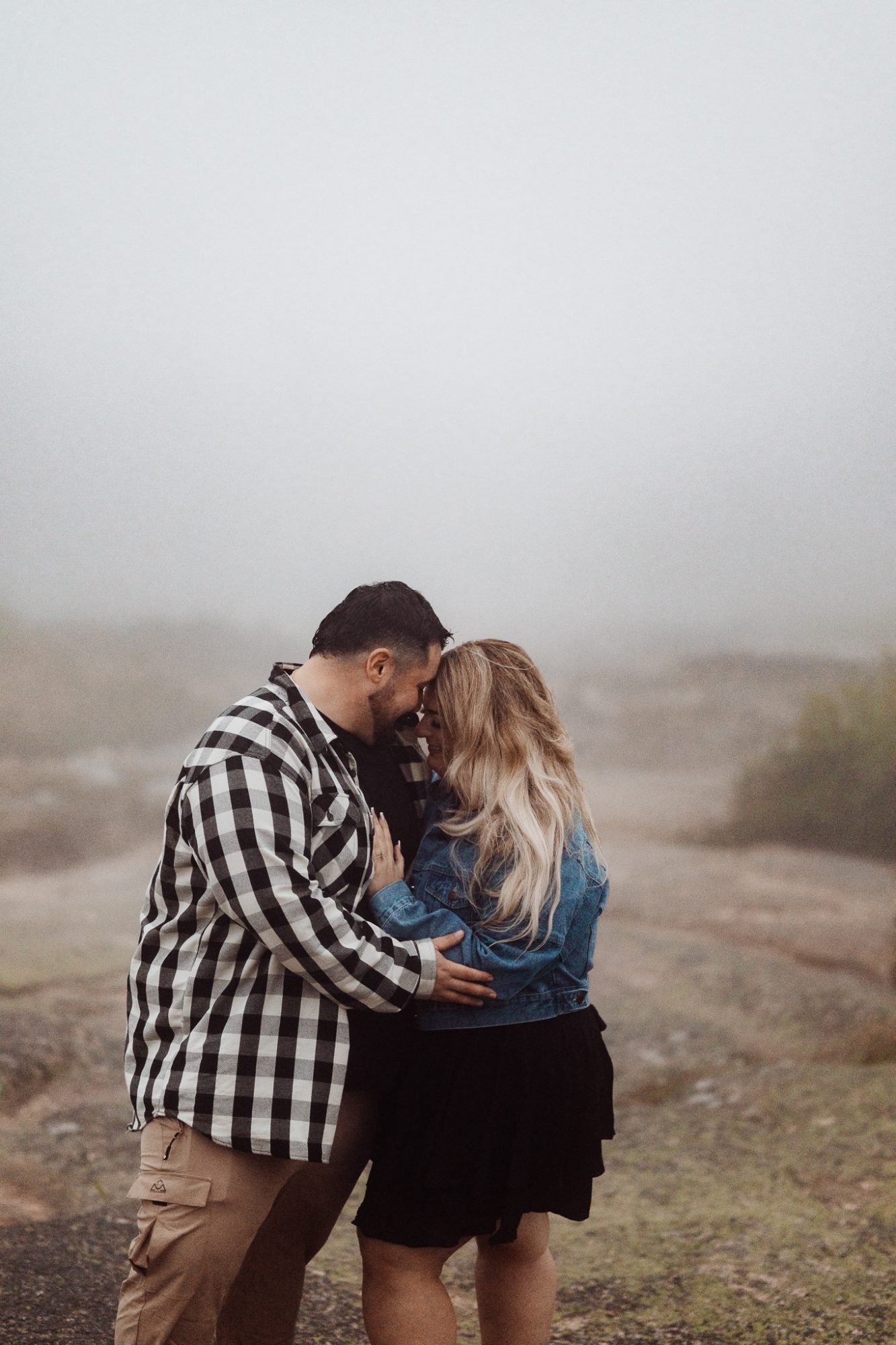 couple embracing in the fog