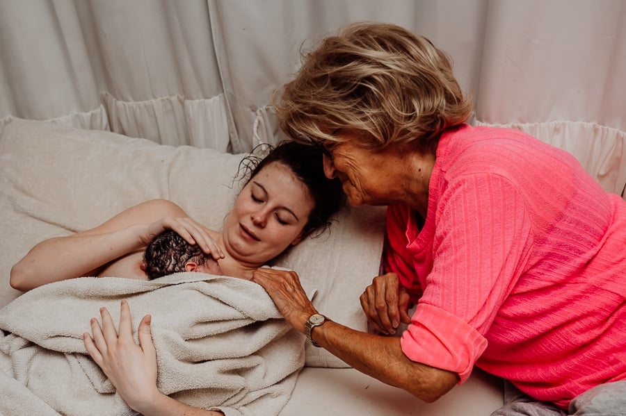 Woman giving birth at home in Maine