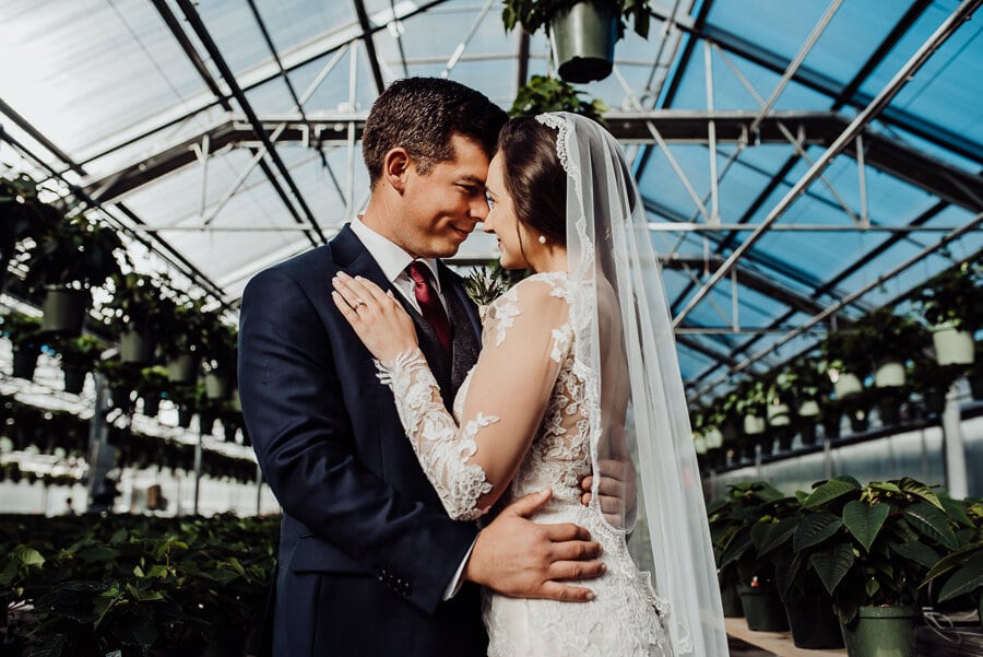Bride and groom in maine greenhouse