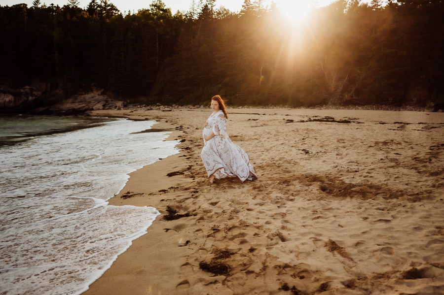 woman in white lace dress on sand beach