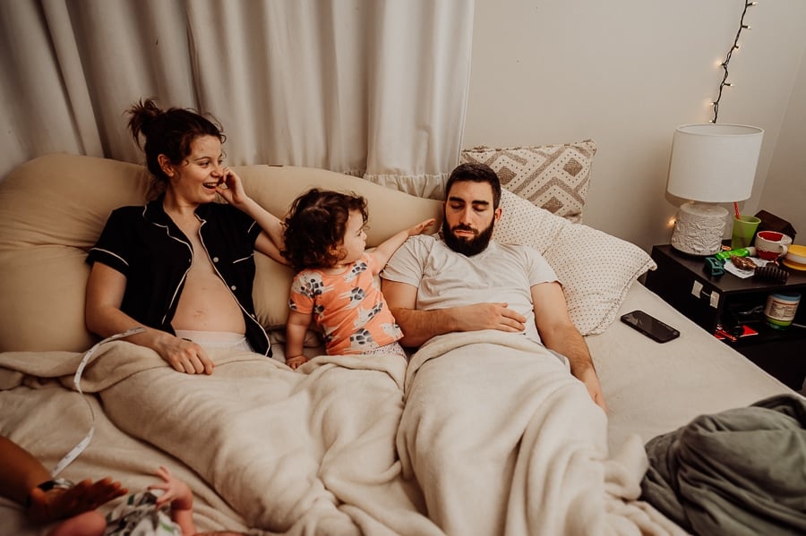 Woman giving birth at home