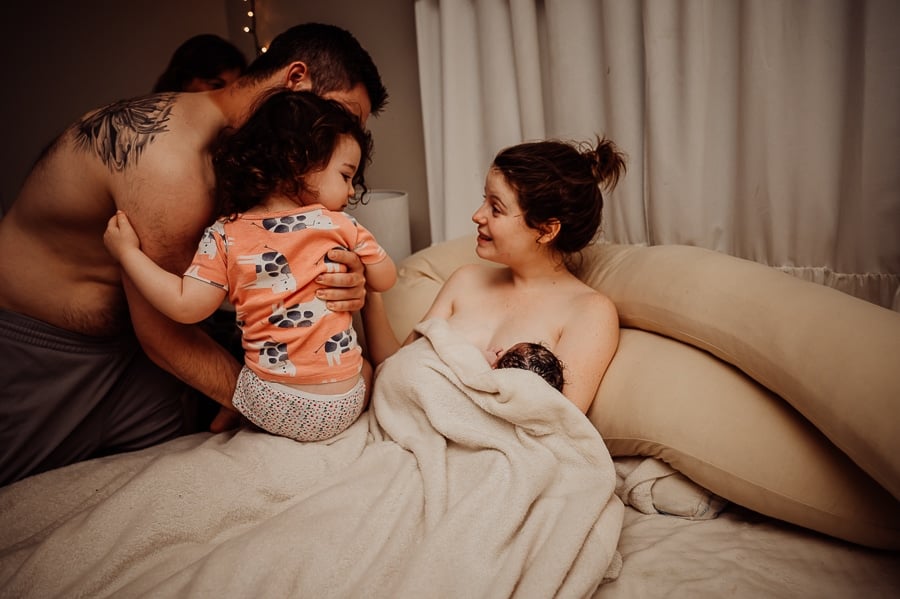 Woman giving birth at home in Maine