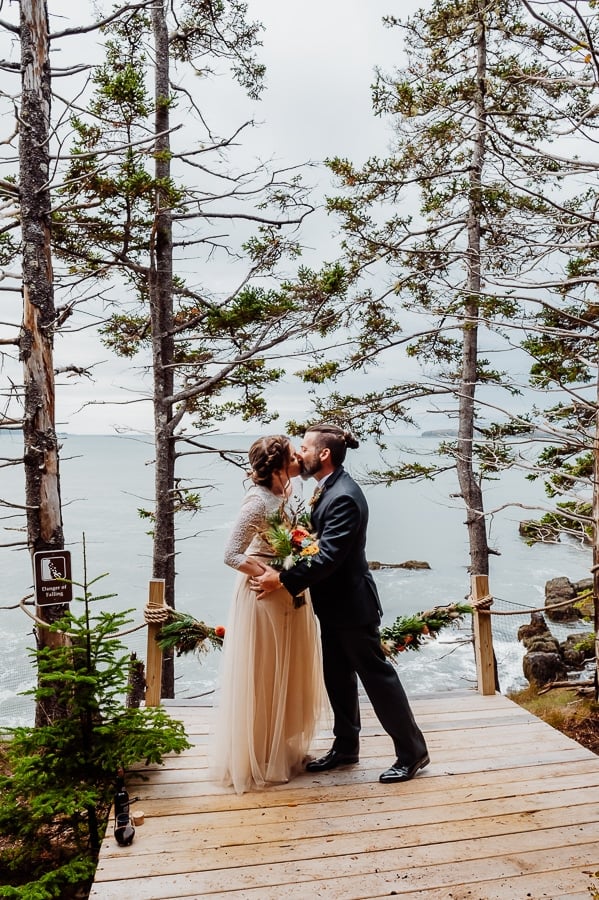 bride and groom share first kiss at wedding elopement in machiasport