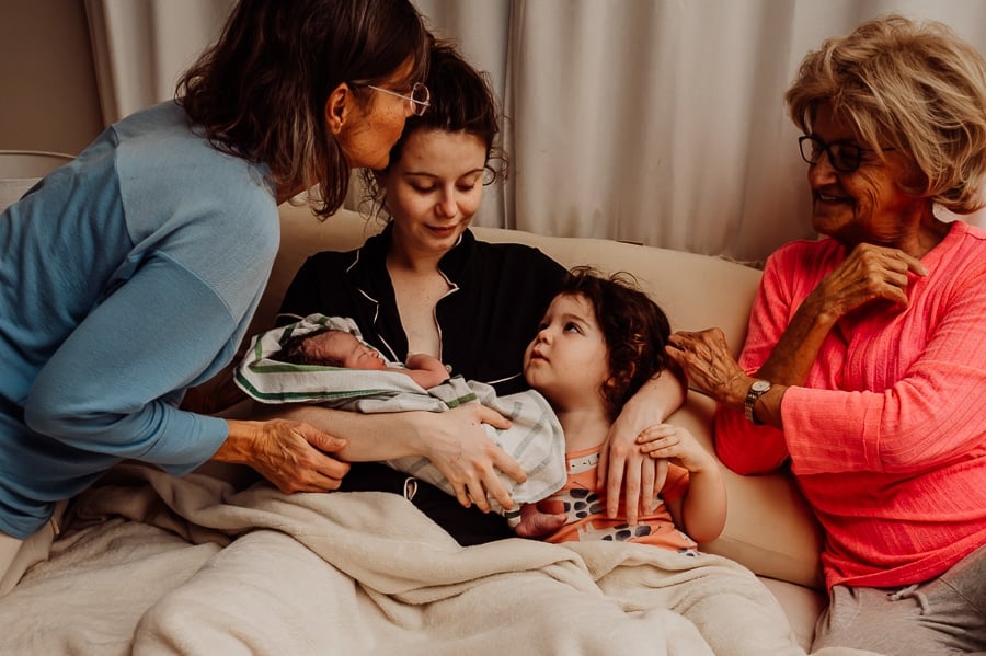 Woman giving birth at home