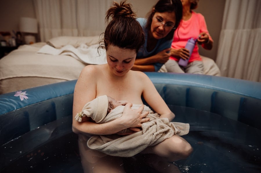 Woman giving birth at home in Maine