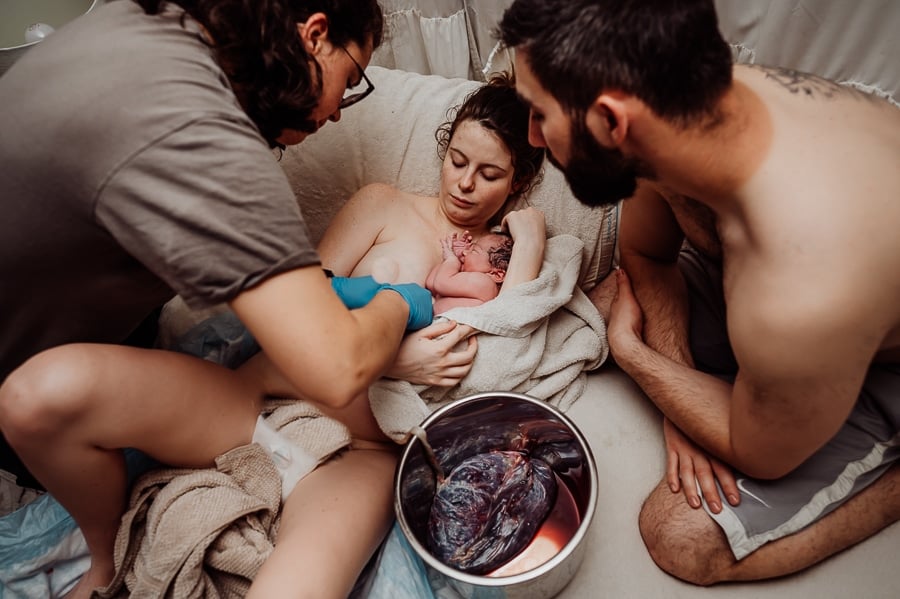 Woman giving birth at home in Maine