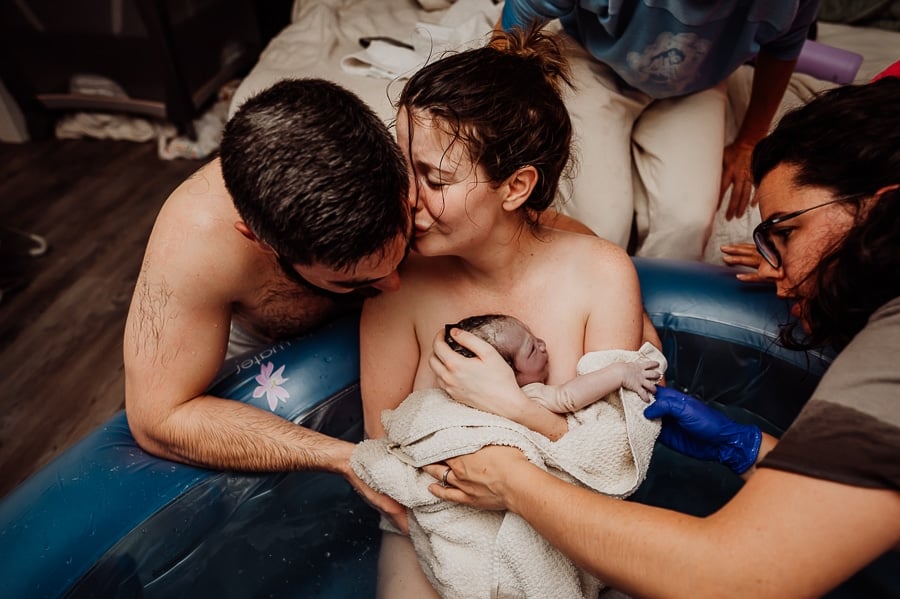 Mother giving birth at home