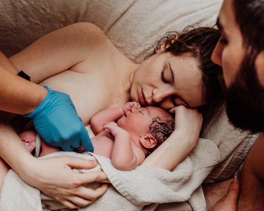 Woman giving birth at home in Maine