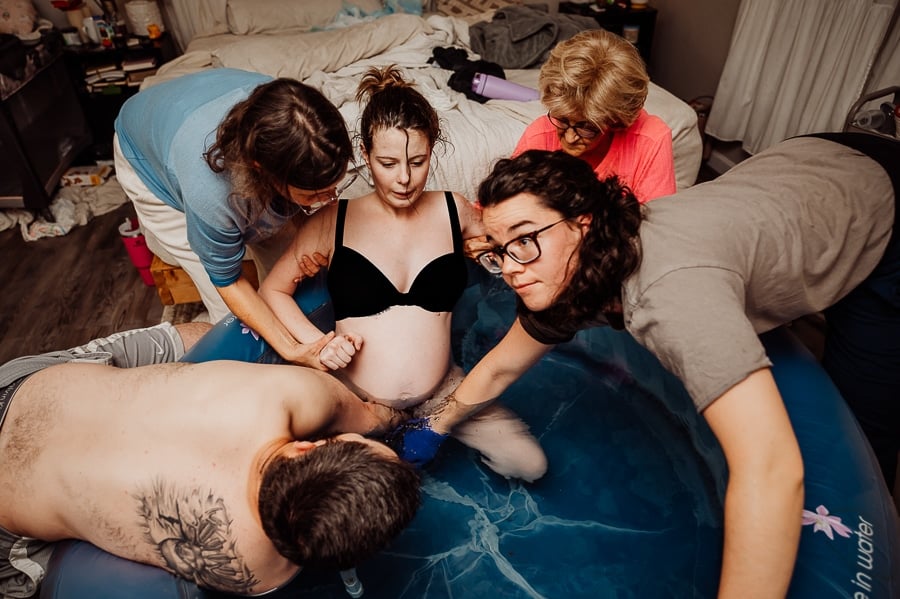 Mother giving birth at home