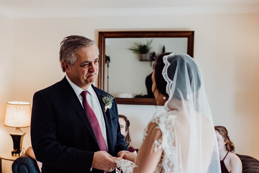 Father looking at bride in Augusta Maine