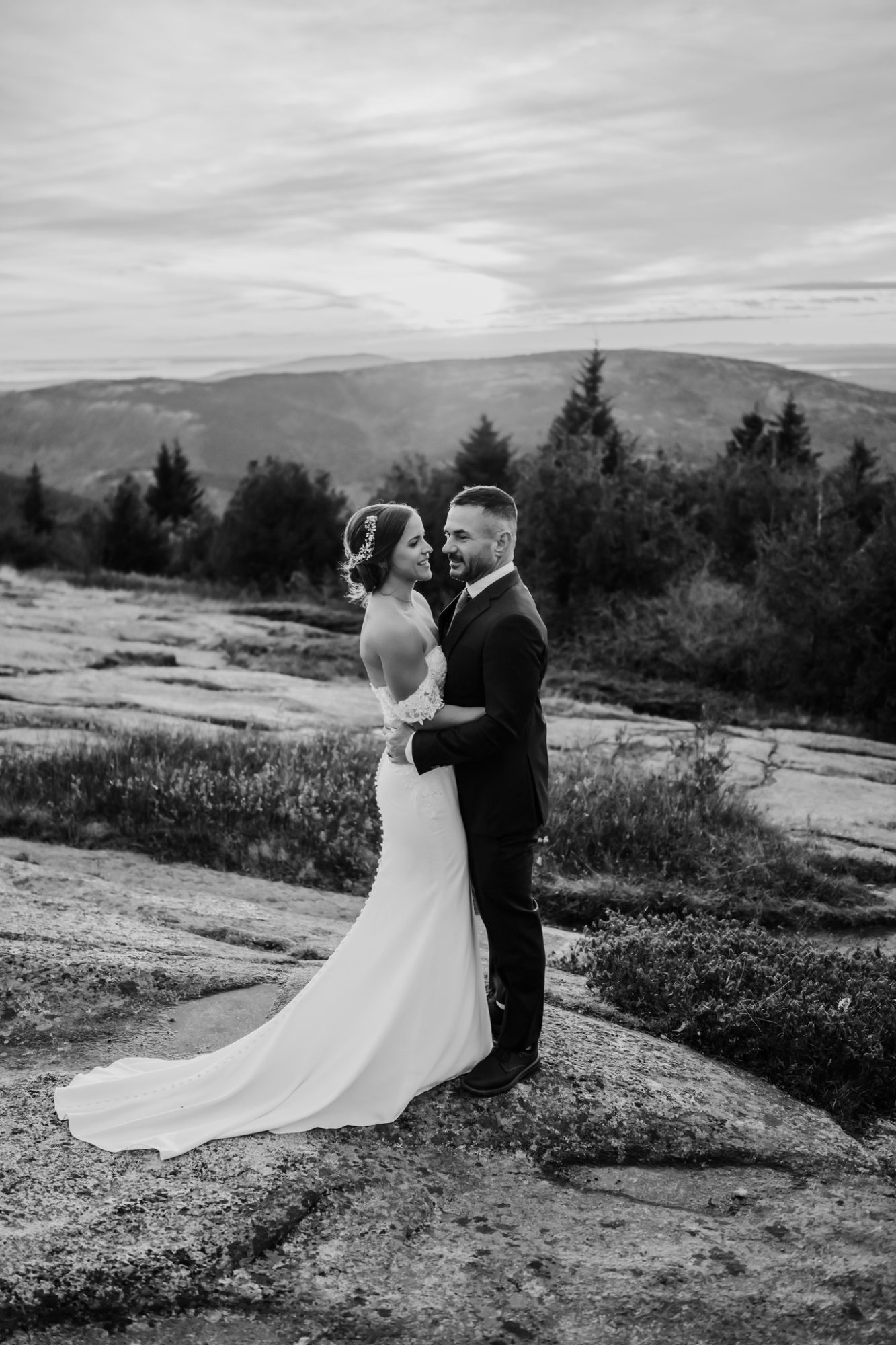 Black and white elopement portrait on the Acadia National Park coastline at Schooner Head Overlook.
