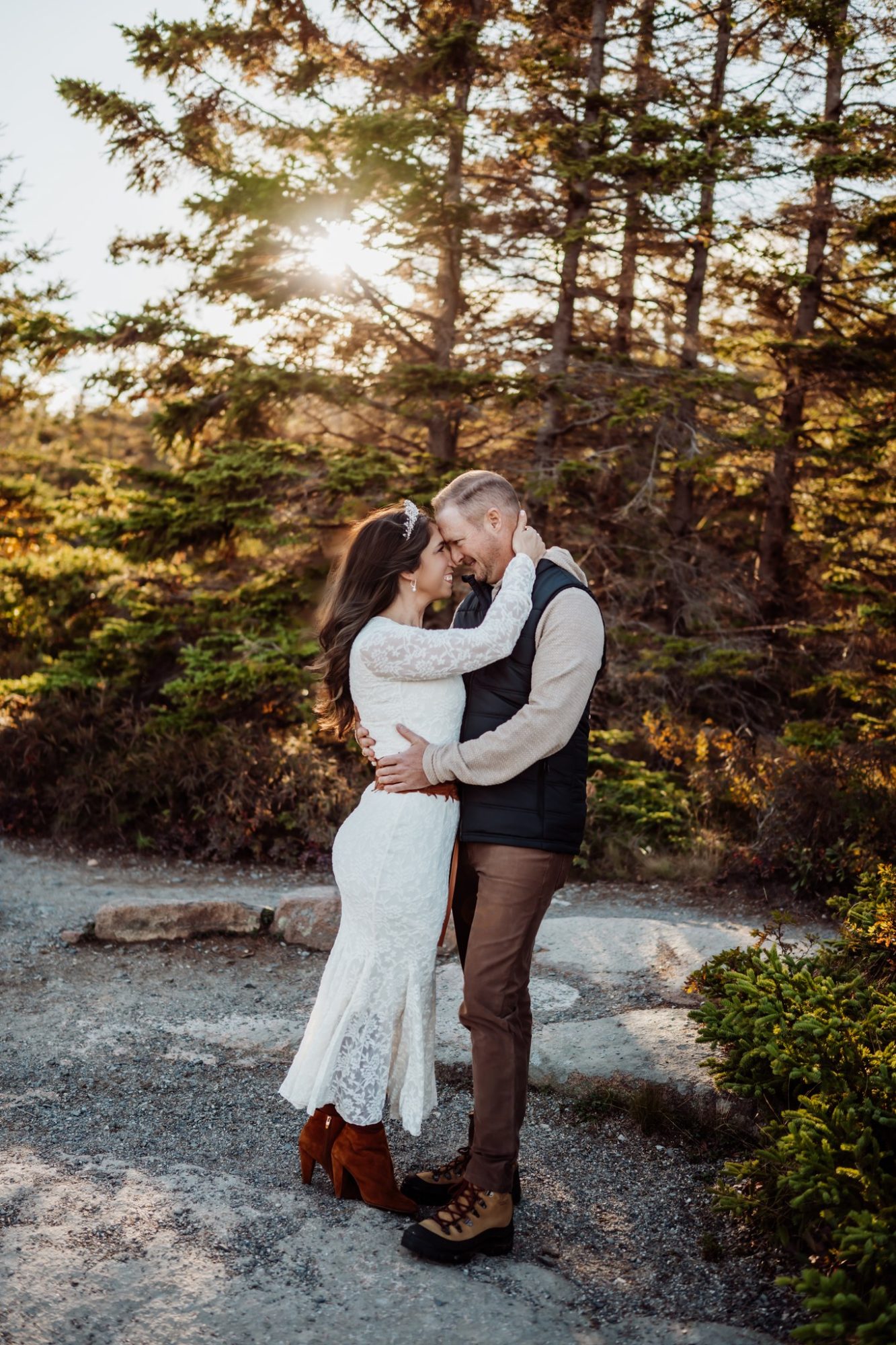 Romantic forest embrace during autumn elopement in Acadia National Park.