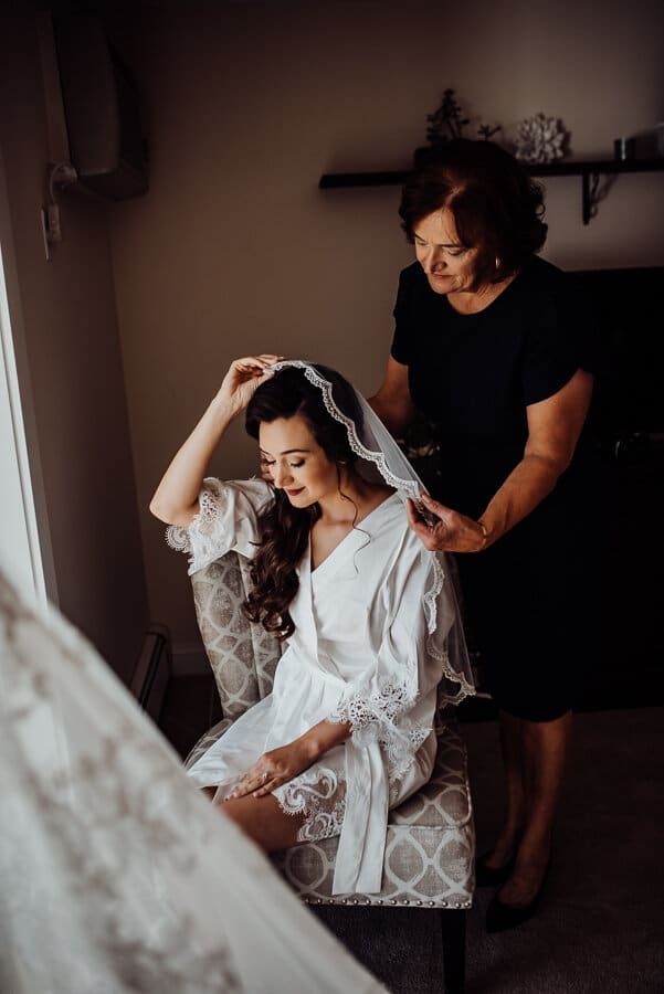 Brides mother puts on veil in Augusta wedding