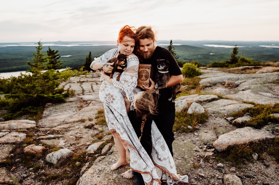 Family with dogs on top of cadillac mountain