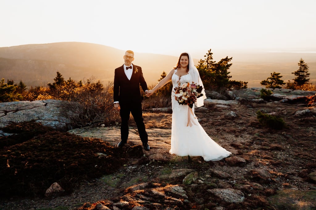 Emotional elopement moment at golden hour in Acadia National Park, Maine