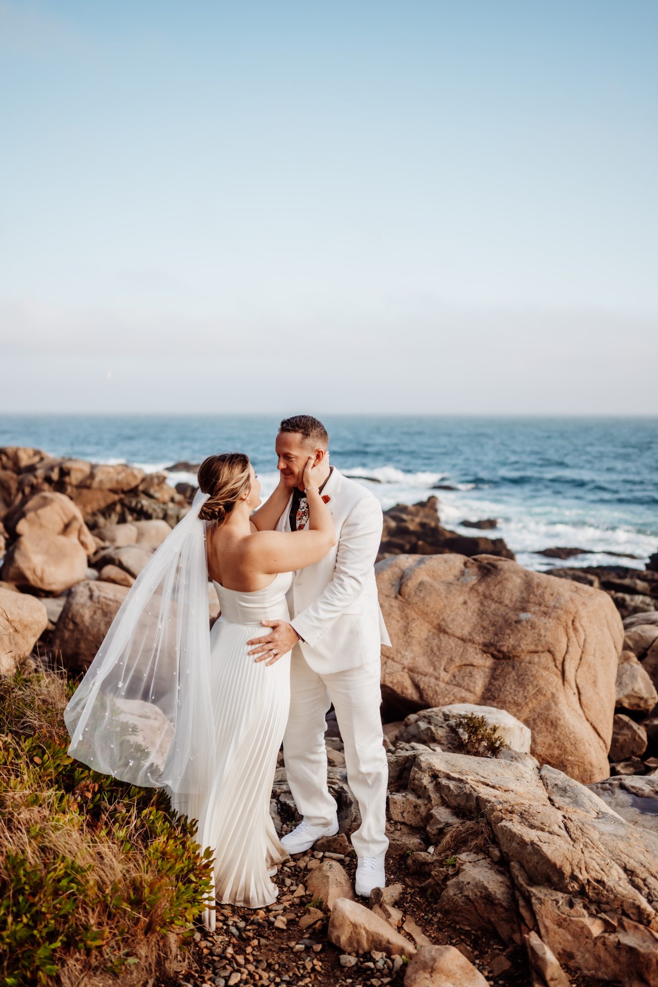 Veil portrait on granite cliffs during Thunder Hole elopement in Acadia National Park.