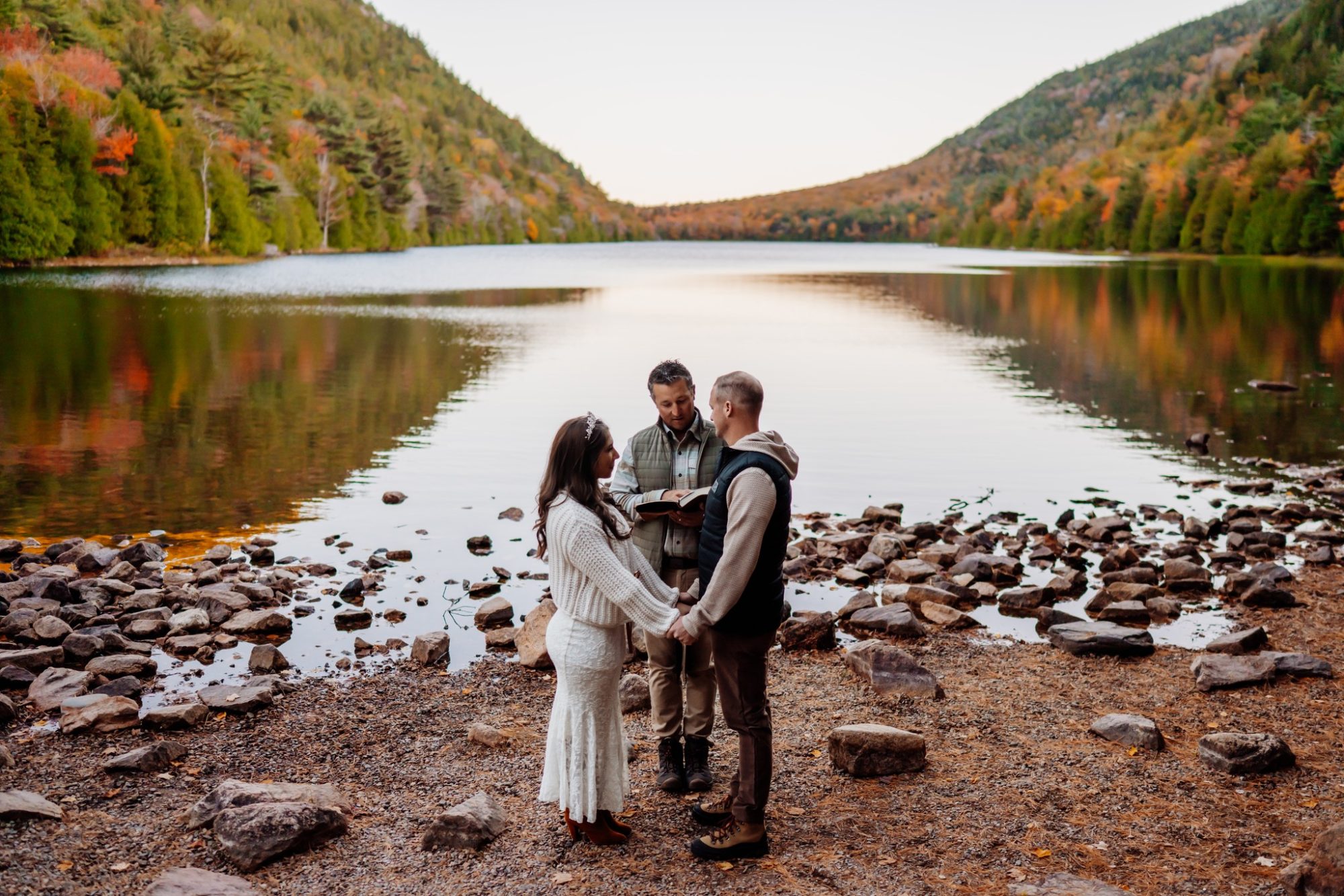 Small lakeside ceremony at Jordan Pond during fall elopement in Acadia.