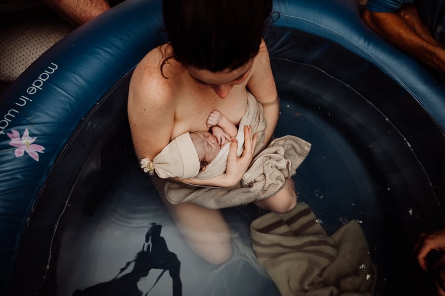 Woman giving birth at home in Maine