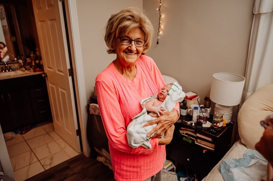Woman giving birth at home
