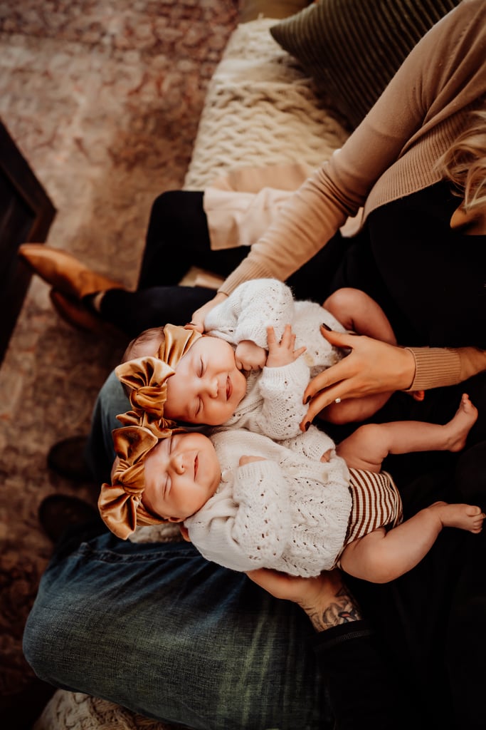 Twin newborn girls posing in home