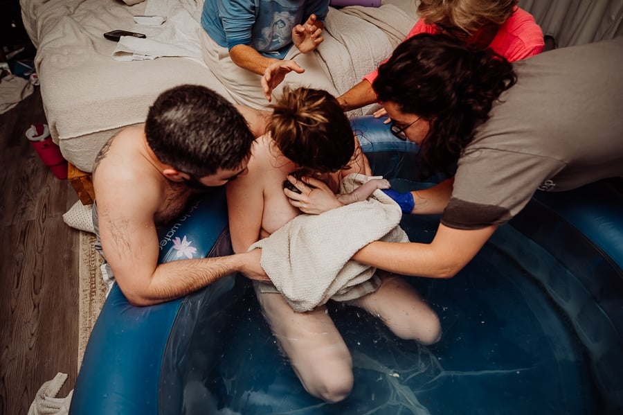 Mother giving birth at home