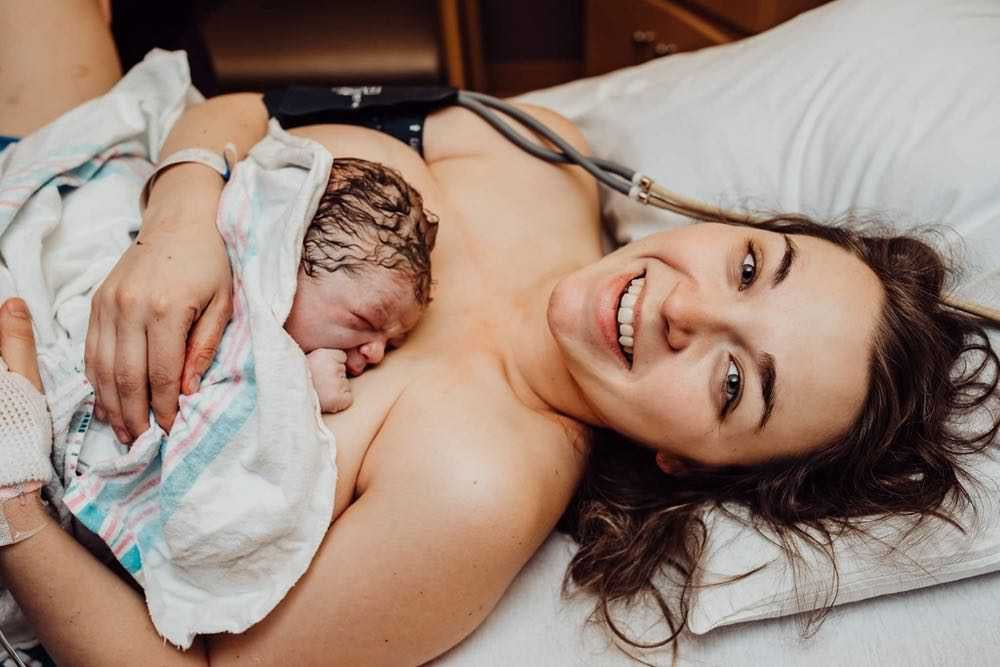 Mother smiling after giving birth