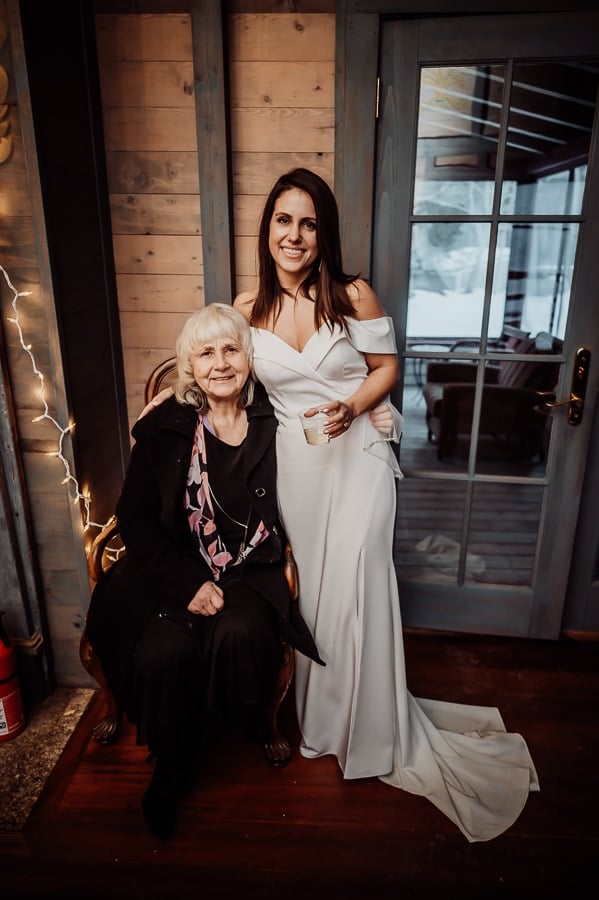 Bride and mother standing together after wedding ceremony