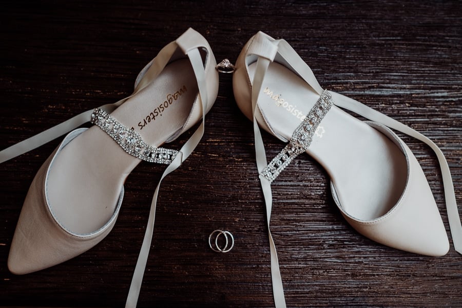 Wedding shoes and rings from above