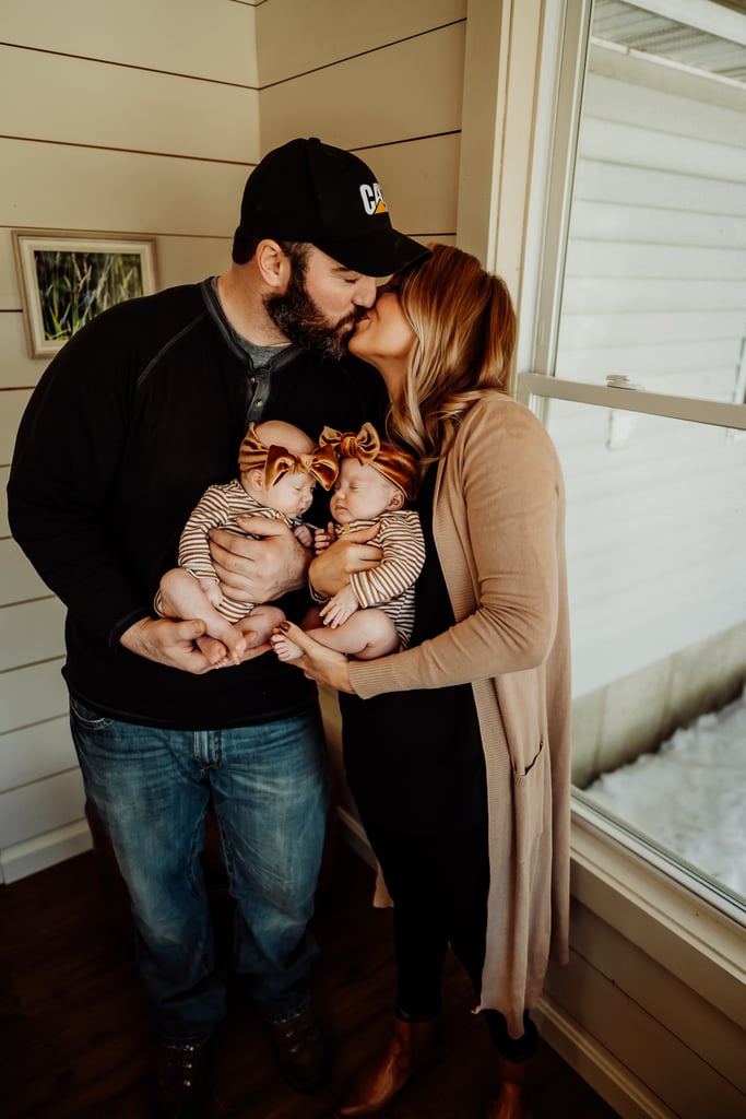 Twin newborn girls posing in home