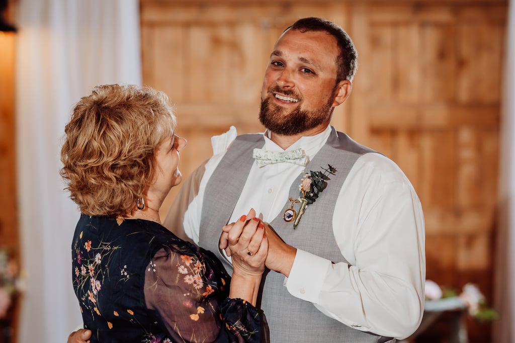 groom dancing with mother at wedding reception in corinna, maine