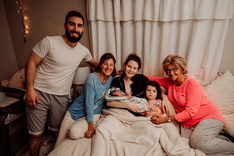 Woman giving birth at home