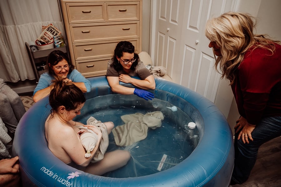 Woman giving birth at home in Maine
