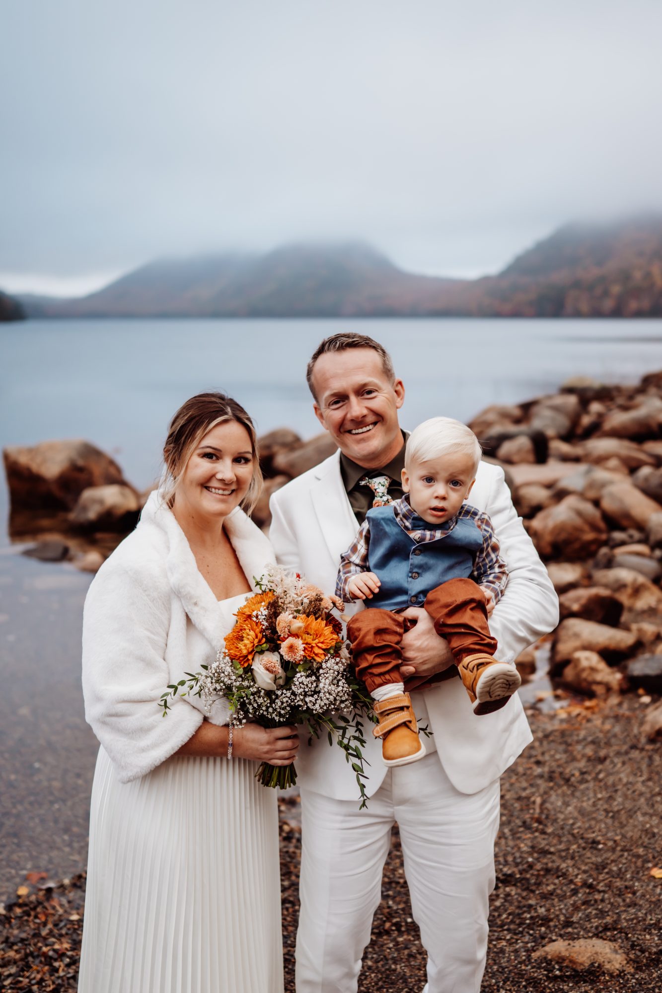 Family portrait during Acadia National Park elopement at Jordan Pond in autumn.
