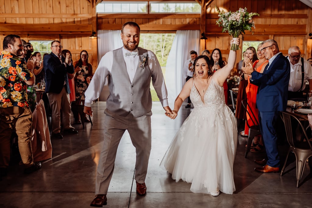 bride and groom entering reception at sunset meadows