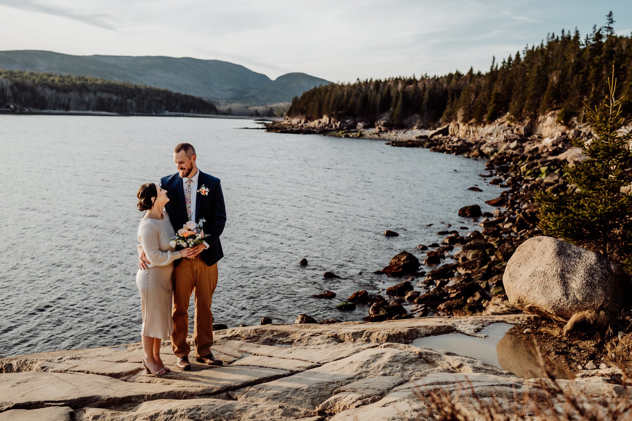 Man and woman embracing each other at otter cliff