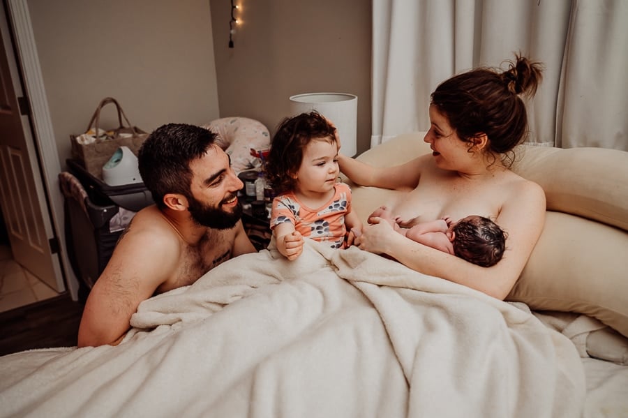 Woman giving birth at home in Maine