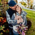 Couple wearing fall styled clothes in front of Bar harbor inn