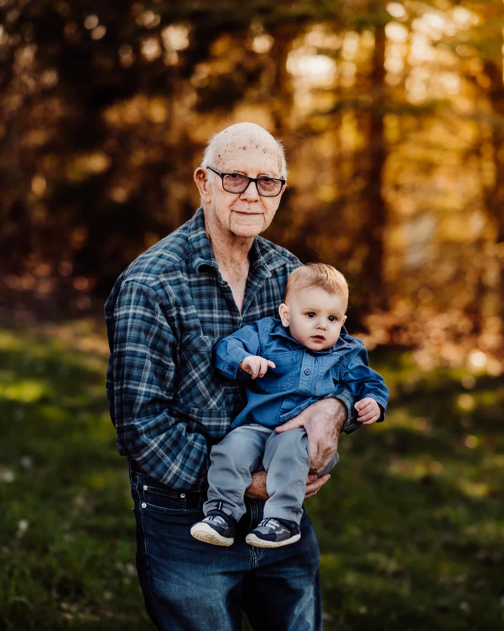 Grandfather holding baby grandson