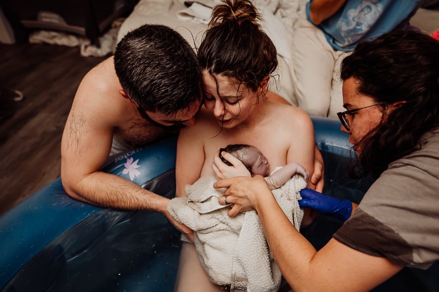 Mother giving birth at home