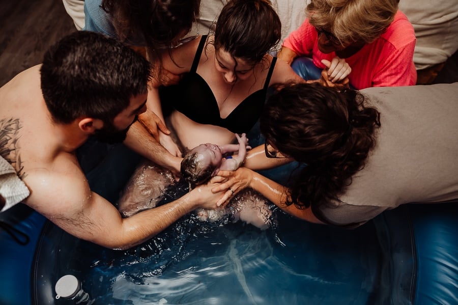 Mother giving birth at home